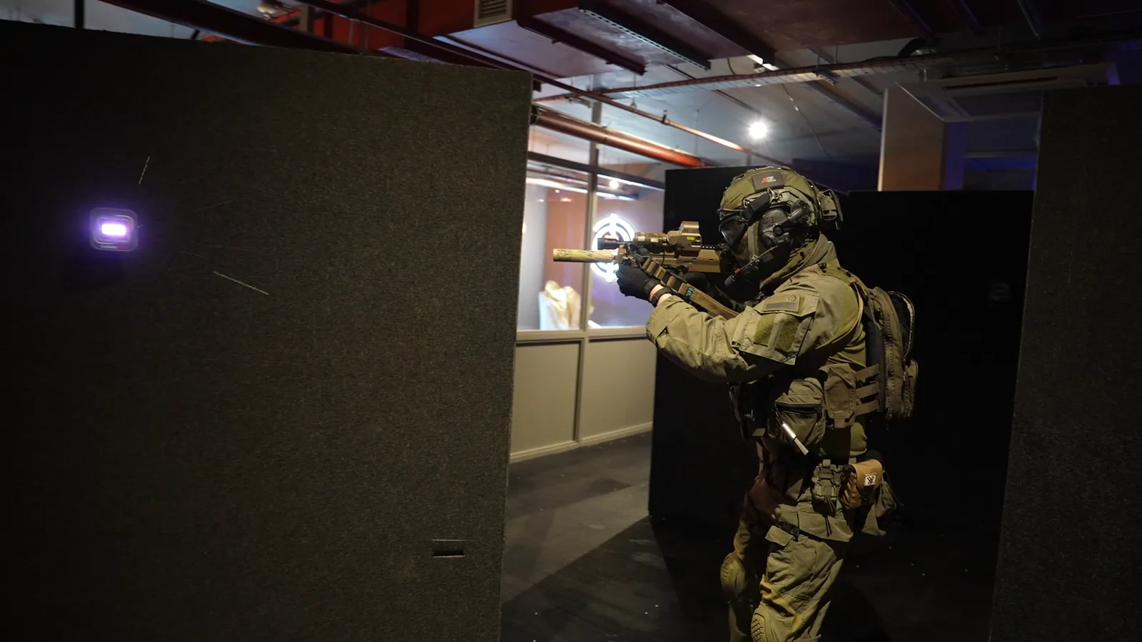 A player navigating the Aldgate CQB arena