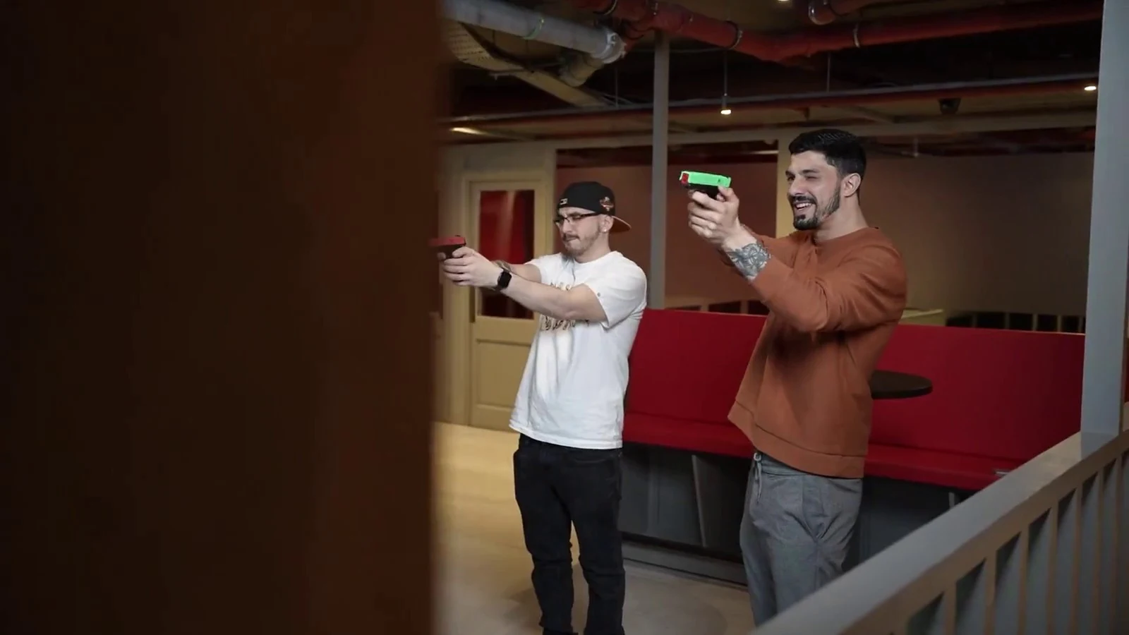 Two guests taking part in a pistol session at Aldgate