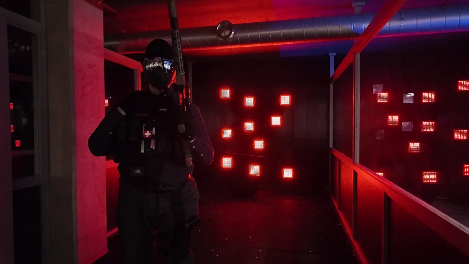 Red-lit airsoft shooting range in Aldgate