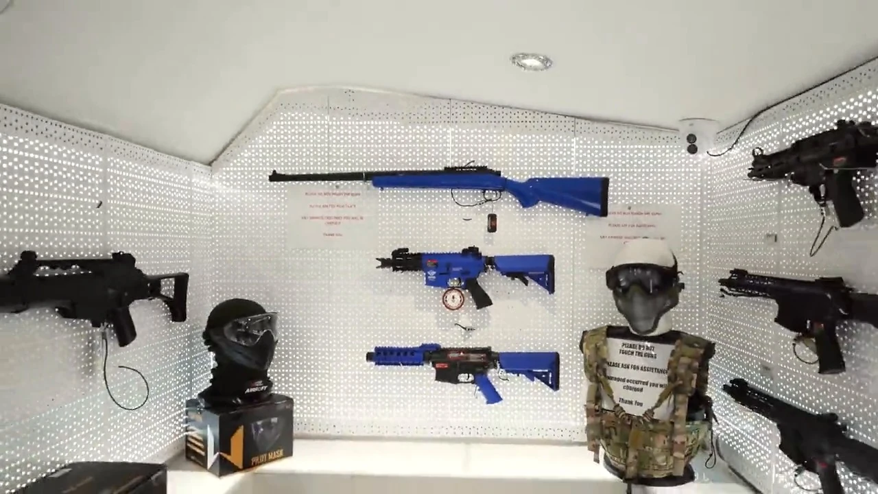 Airsoft replicas on the shop equipment wall in Camden
